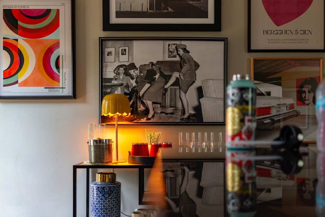 Framed black and white documentary photographs displayed on a gallery wall